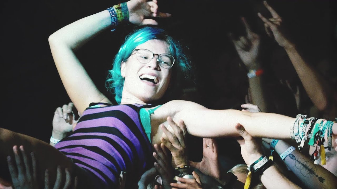 A girl crowdsurfs at Brackrock music festival