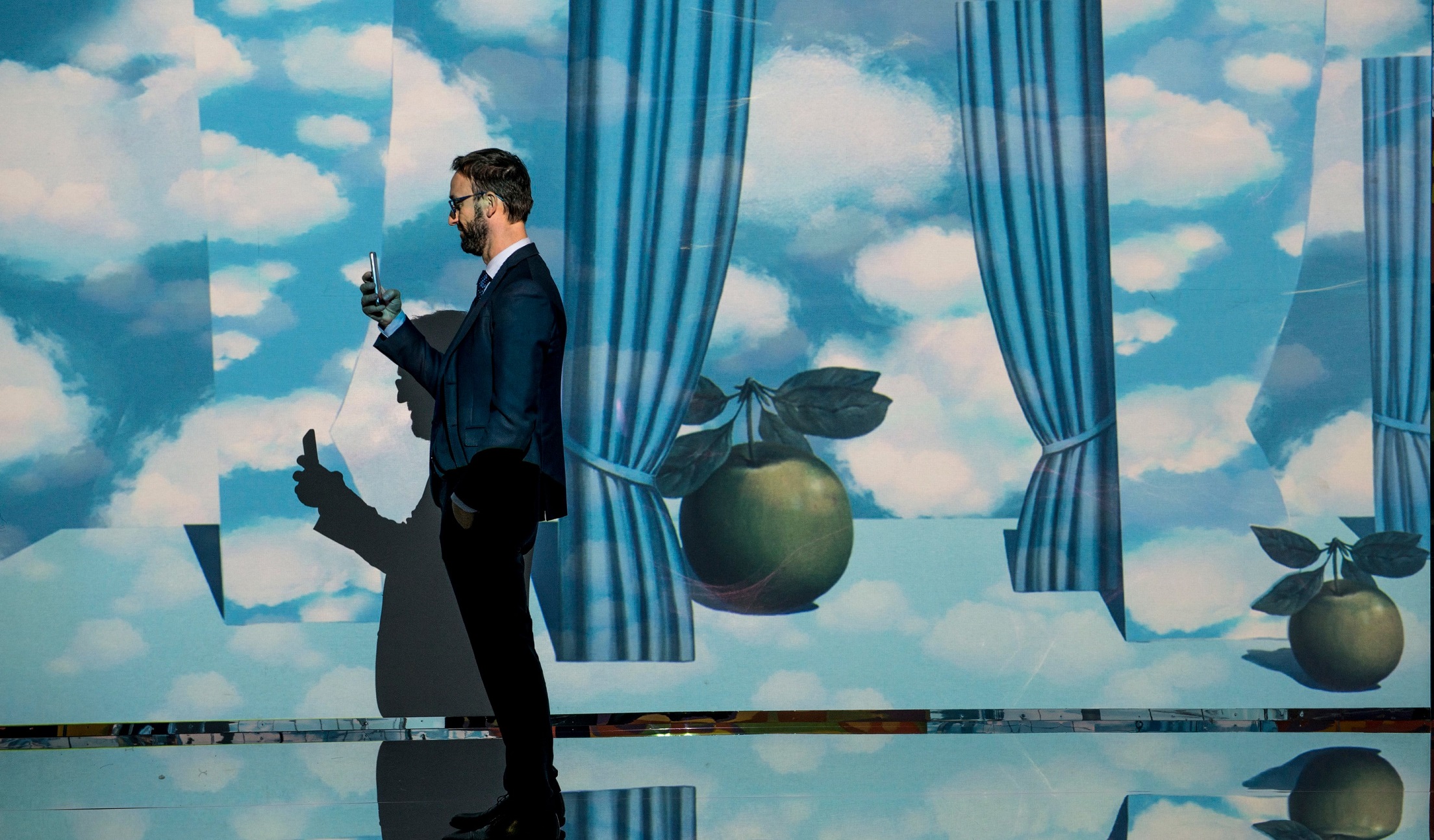 A man walks through the Inside Magritte experience 
