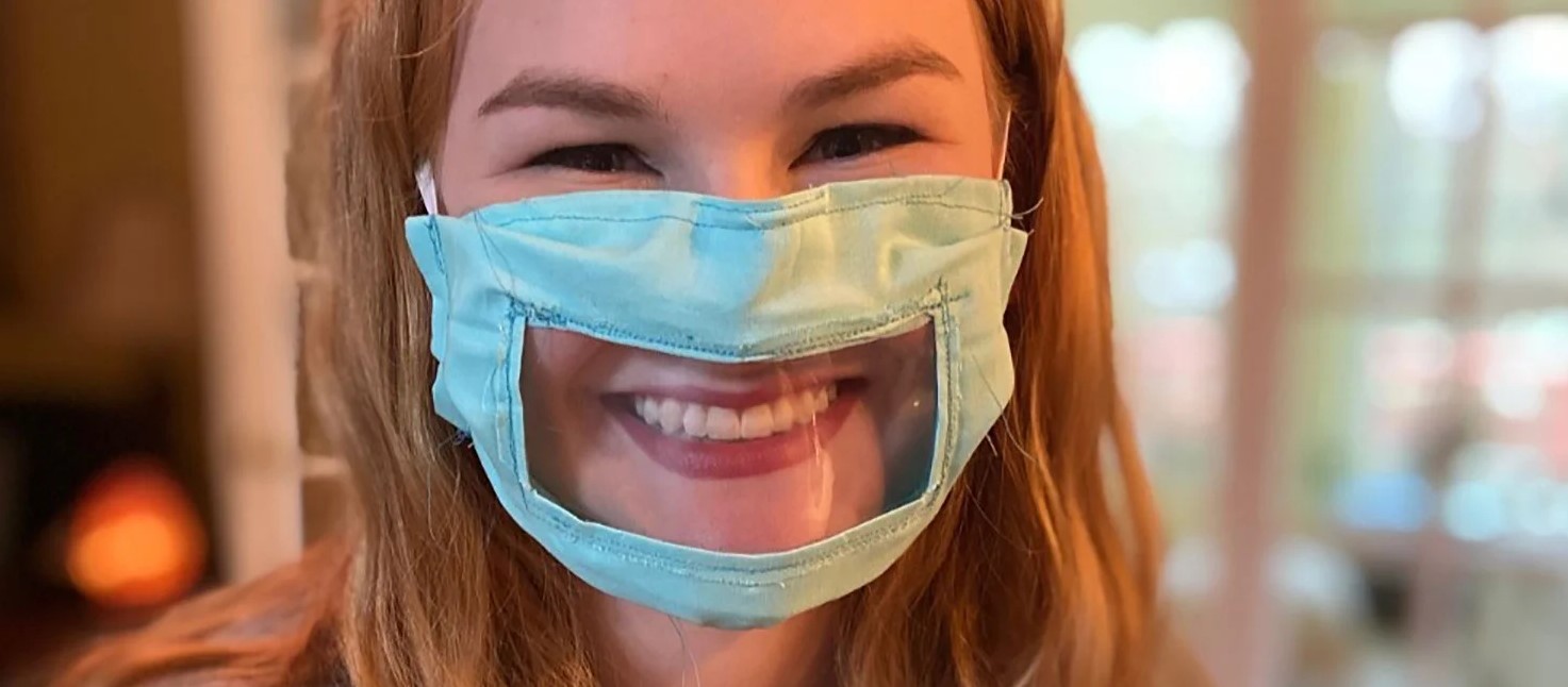 Woman wears transparant facemask