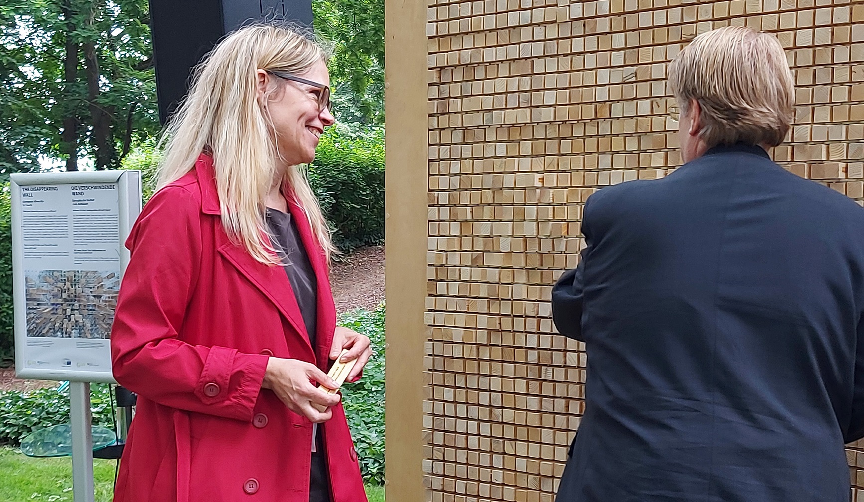 Goethe Institute director Elke Kaschl Mohni and German ambassador Martin Kotthaus in front of the Disappearing Wall in the Citizens’ Garden  