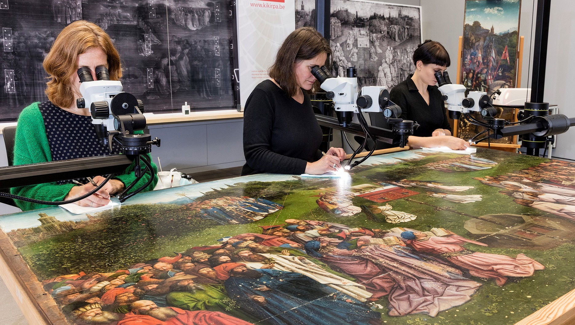 Restorers work on the Ghent Altarpiece