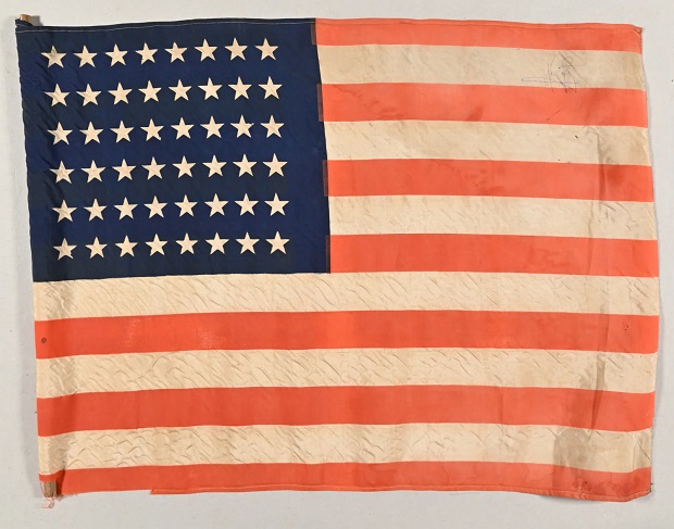 American flag signed by Neil Armstrong among unusual American items to go under auction hammer in Brussels