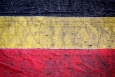 Illustration picture shows a muddy Belgian flag. (BELGA PHOTO DAVID STOCKMAN)