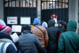 Illustration shows refugees waiting outside, in the cold, at the entry to the 'Klein Kasteeltje - Petit Chateau' (Little Castle) Fedasil registration centre for asylum seekers in Brussels, Tuesday 07 December 2021. (BELGA PHOTO VIRGINIE LEFOUR)