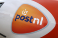 The logo of PostNL pictured on the side of a delivery van. (BELGA PHOTO PHILIPPE FRANCOIS)