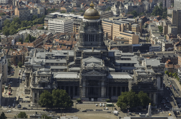 An aerial view of the justice palace (Justitiepaleis - Palais de Justice) as a police helicopter flies over the city centre of Brussels. (BELGA PHOTO THIERRY ROGE)