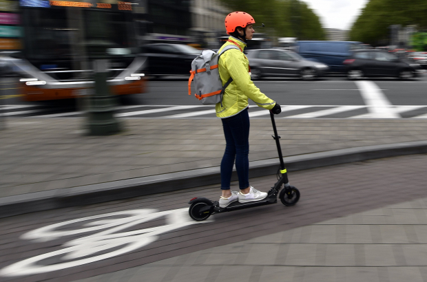 Illustration picture shows the a person riding an electric moped scooter in Brussels, Friday 03 May 2019. (BELGA PHOTO ERIC LALMAND)