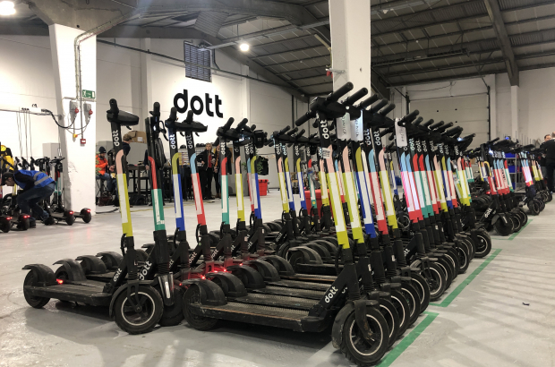 E-scooters lined up at a Dott depot in Brussels. (BELGA PHOTO NILS QUINTELIER)