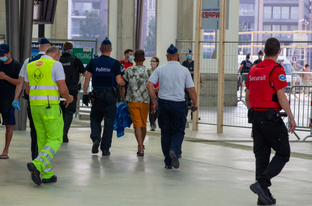 A man is led away by police after committing an offence in a Belgian train station. Brussels train stations have seen a significant rise in crime in contrast to stations in other provinces. (BELGA PHOTO NICOLAS MAETERLINCK)