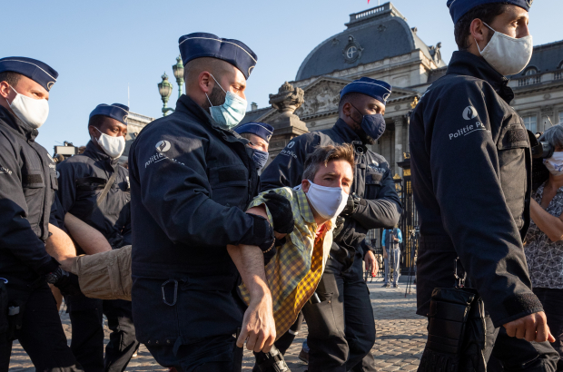 Police arrest a climate activist outside the Royal Palace in Brussels, Monday 21 September 2020, (BELGA PHOTO BENOIT DOPPAGNE)