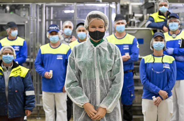 Queen Mathilde of Belgium, wearing protective cover-alls, a mouth mask and a hair net, pictured during a virtual event called 'A Belgian alliance for ambitious climate objectives' organised by The Shift, WWF Belgium and Danone, Monday 12 October 2020, in Danone in Rotselaar. (BELGA PHOTO DIRK WAEM)