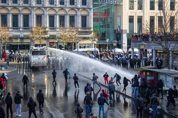 Illustration picture shows police using the water canon against protesters at the Place Saint Lambert during riots in the city centre of Liege, Saturday 13 March 2021. Some 200 people who were demonstrating as part of the 'Black lives matter' action attacked the Liege police in various places in the city centre and a fast food restaurant was ransacked. Several policemen were injured. (BELGA PHOTO THOMAS MICHIELS)