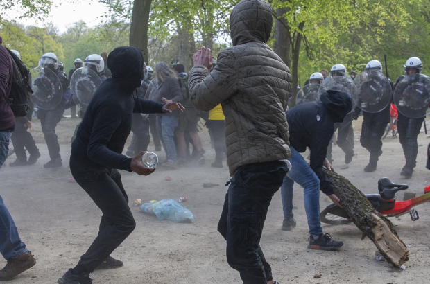 Police and protesters clash during the second edition of the illegal 'La Boum - L'Abime' festival, a protest against the current corona restrictions, at the Bois de La Cambre - Ter Kamerenbos, in Brussels, Saturday 01 May 2021. (BELGA PHOTO NICOLAS MAETERLINCK)