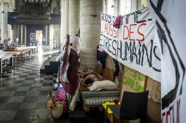 Illustration shows banners at the site of a hunger strike by people without papers occupying the Saint John the Baptist at the Beguinage - Sint-Jan Baptist ten Begijnhofkerk - Eglise Saint-Jean-Baptiste-au-Beguinage church in Brussels, Monday 19 July 2021. ( BELGA PHOTO HATIM KAGHAT)