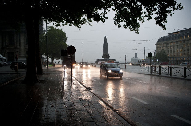 BRUSSELS, BELGIUM: Illustration picture shows cars driving through heavy rain, under dark skies in Brussels (BELGA PHOTO DRIES LUYTEN)