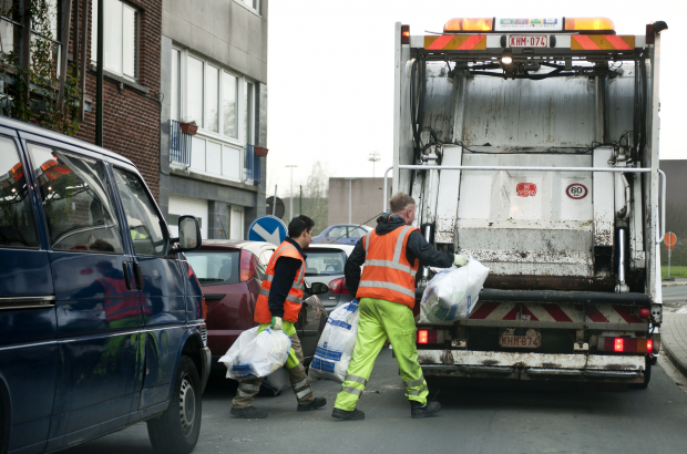 BRUSSELS, BELGIUM : Picture shows a Brussels Capital Region Garbage truck and garbageman as they fill it with plastic trash bags (BELGA PHOTO JONAS HAMERS)