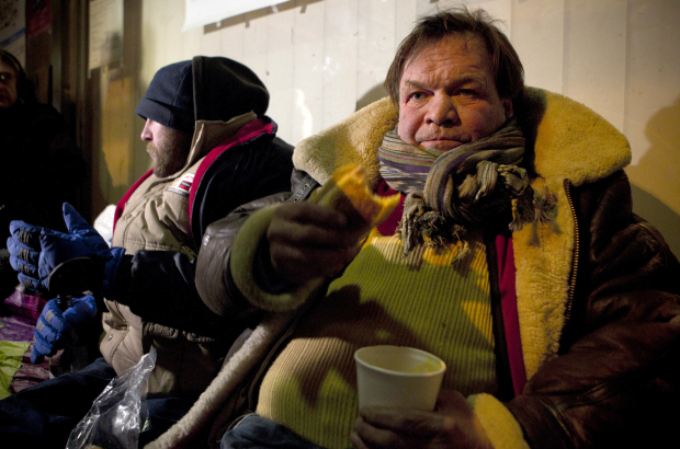 20120201 - BRUSSELS, BELGIUM: Illustration picture shows two homeless men receiving hot food from volunteers on the streets of Brussels. (BELGA PHOTO KRISTOF VAN ACCOM)