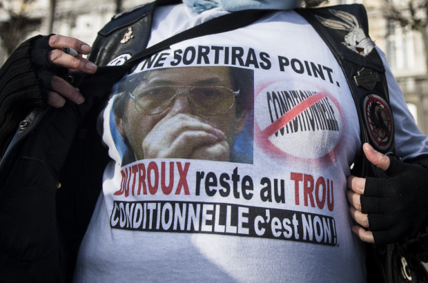 An activist wears a t-shirt protesting the possible release on parole of child murderer Marc Dutroux. Public opposition to his release remains strong in Belgium (BELGA PHOTO)