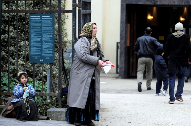 BRUSSELS, BELGIUM: Illustration picture shows a beggar with a child in front of a mosque in Brussels. (BELGA PHOTO DIRK WAEM)