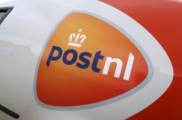 The logo of PostNL pictured on the side of a delivery van. (BELGA PHOTO PHILIPPE FRANCOIS)