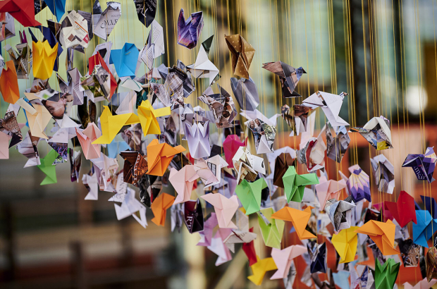 Origami birds hang rom the ceiling in Charles Kaisin's installation. © Charles Kaisin