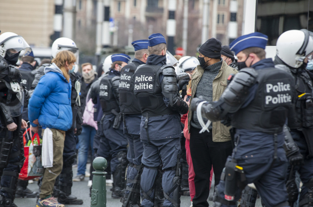 Riot police arrest protesters at an unauthorized protest demonstration against the curfew organized by the association 'Vecht voor je recht', in front of the Brussels Central Station, in the city centre of Brussels, Sunday 31 January 2021. (BELGA PHOTO NICOLAS MAETERLINCK)