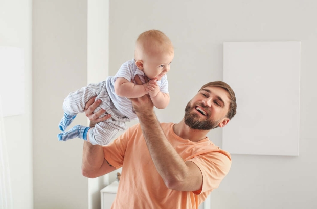 A father plays with his baby (Free Licence/Negative Space) A father plays with his baby (Free Licence/Negative Space)