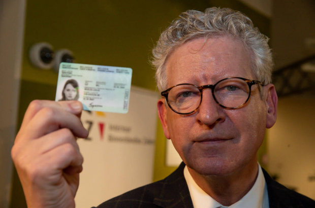 Former Minister of Interior Affairs and Foreign Trade Pieter De Crem pictured with the new eID during the launch of the new eID, electronic identity card, Tuesday 14 January 2020, in Lokeren. (BELGA PHOTO NICOLAS MAETERLINCK)