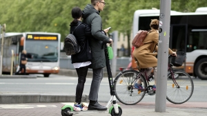 Illustration picture shows people riding the Lime-S moped scooter sharing system in Brussels, Friday 03 May 2019. (BELGA PHOTO ERIC LALMAND)