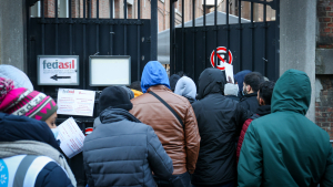 Illustration shows refugees waiting outside, in the cold, at the entry to the 'Klein Kasteeltje - Petit Chateau' (Little Castle) Fedasil registration centre for asylum seekers in Brussels, Tuesday 07 December 2021. (BELGA PHOTO VIRGINIE LEFOUR)