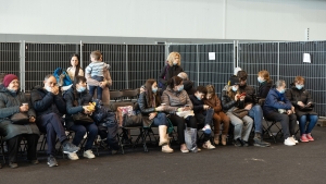 People await their turn at a centre for the registration of Ukrainian refugees, at the Palace 8 hall of Brussels expo, Monday 14 March 2022. The centre is opened to welcome Ukrainians fleeing their country after the Russian invasion. (BELGA PHOTO JAMES ARTHUR GEKIERE) People await their turn at a centre for the registration of Ukrainian refugees, at the Palace 8 hall of Brussels expo, Monday 14 March 2022. The centre is opened to welcome Ukrainians fleeing their country after the Russian invasion. (BELGA PHOTO JAMES ARTHUR GEKIERE)