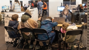 Ukrainians complete their registration at a center for the registration of Ukrainian refugees, at the Palace 8 hall of Brussels expo, Monday 14 March 2022. The center is opened to welcome Ukrainians fleeing their country after the Russian invasion. BELGA PHOTO JAMES ARTHUR GEKIERE Ukrainians complete their registration at a center for the registration of Ukrainian refugees, at the Palace 8 hall of Brussels expo, Monday 14 March 2022. The center is opened to welcome Ukrainians fleeing their country after the Russian invasion. BELGA PHOTO JAMES ARTHUR GEKIERE