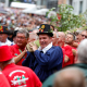 Brussels City mayor Philippe Close (C) pictured during the 2019 edition of the Meyboom festivities in Brussels, Thursday 08 August 2019. The tradition of the Meyboom (Meiboom) is based on a medieval legend, to celebrate a victory over the city of Leuven. Nowadays, it is a highly colourful parade, held every 9 August, in which a tree is brought to Brussels, featuring a brass band, giants and people dressed in folk dress. The erection of the Meyboom is recognised as an expression of intangible heritage by Une