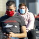 A man checks his smartphone in a street in Brussels (BELGA PHOTO)