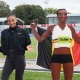 Nafi Thiam next to life-size Lego statue