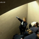 A Belgian police officer gives a Nazi salute while Jozef Chovanec is restrained in the holding cell at Charleroi Airport, Feb. 24, 2018 (©YouTube/Belgian Police)