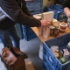 Illustration picture shows a person collecting food at the Openplaats.be foodbank, in Gent. The number of people using food banks has increased. (BELGA PHOTO NICOLAS MAETERLINCK)